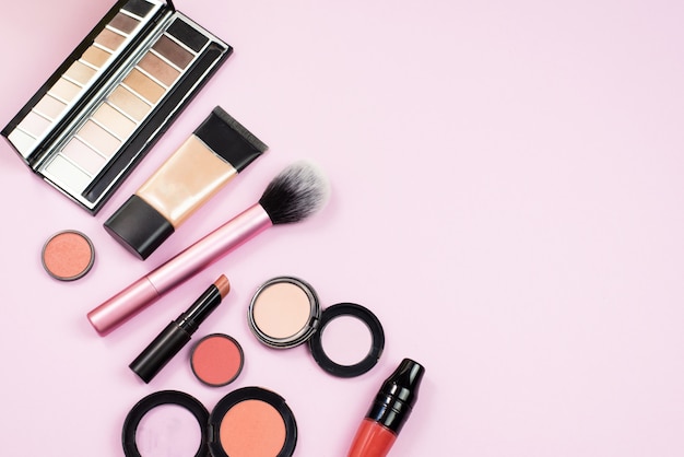 cosmetics on pink table