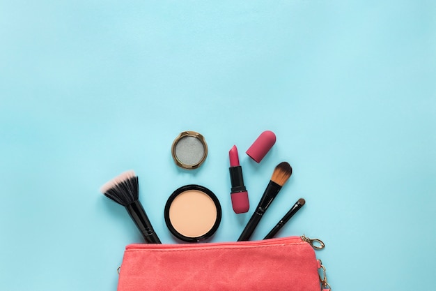 Cosmetics scattered from beauty bag 