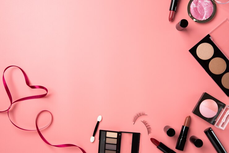 Foto cosmetische make-up plat leggen roze achtergrond kopie ruimte tekst schoonheid