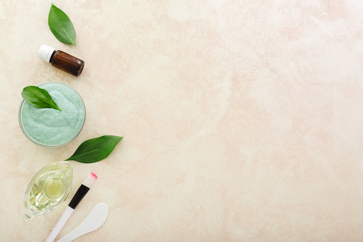 Photo cosmetology set for cooking applying face mask avocado face mask spatula brush oil essential oil