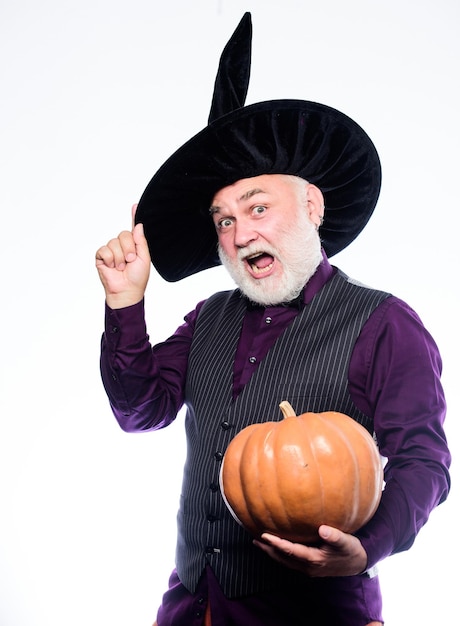 Cosplay outfit Senior man white beard celebrate Halloween with pumpkin Wizard costume hat Halloween party Magician witcher old man Magic concept Experienced and wise Halloween tradition