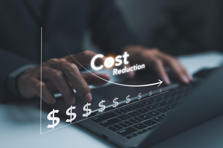 Cost reduction concept Businessman working on company cost saving Cost wording on decrease money with down arrow Cost Management Economy recession low budget Effective business Expense reduce