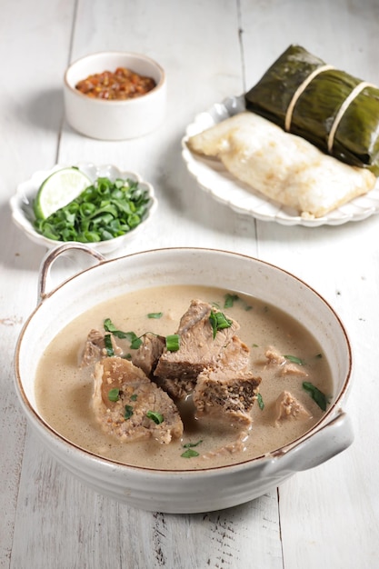 Coto Makasar is Indonesian traditional food from Makasar, Sulawesi, served with Buras.