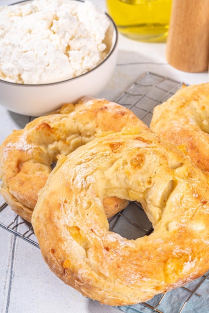 Cottage cheese bagels Trendy curd cheese baking bread rings with cottage cheese and parmesan savory nonsweet breakfast baked cheesy donuts