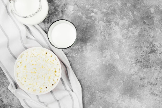 Cottage cheese in bowl and milk in glass