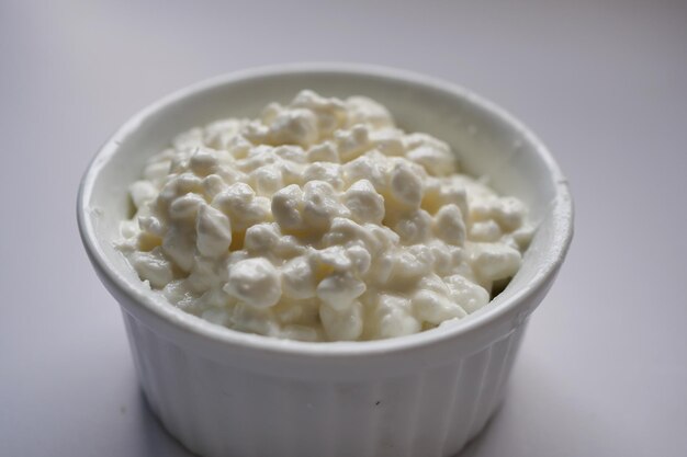 Cottage cheese in a bowl on table