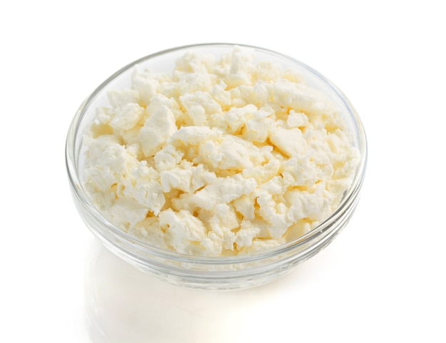 Cottage cheese in bowl on white