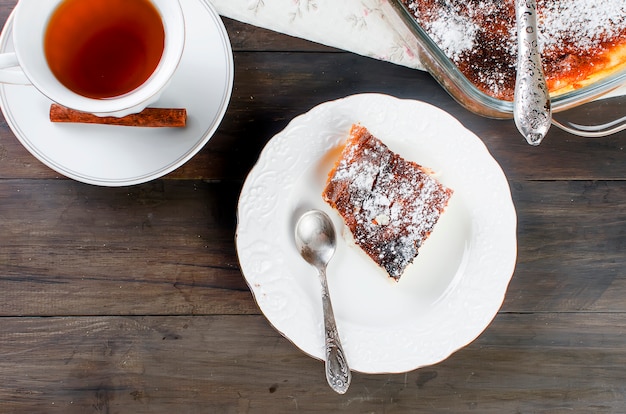 Cottage cheese casserole , Pie with cheese and cup of tea