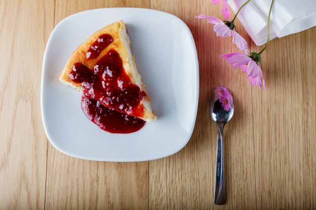 Photo cottage cheese casserole with raspberry jam