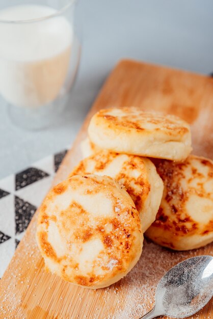 Cottage cheese cheesecakes on a wooden board