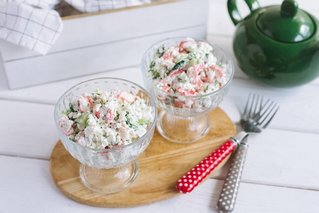 Cottage cheese crab salad tender and light salad two portions\
in glass bowls