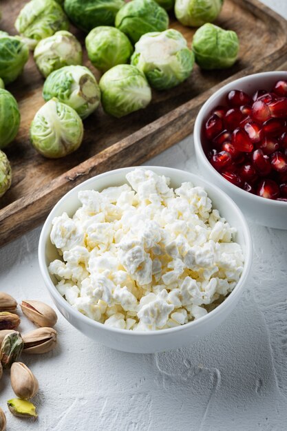 Cottage cheese or curd, on white textured background