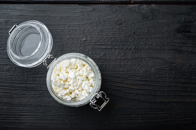 Cottage cheese or curd on wooden table