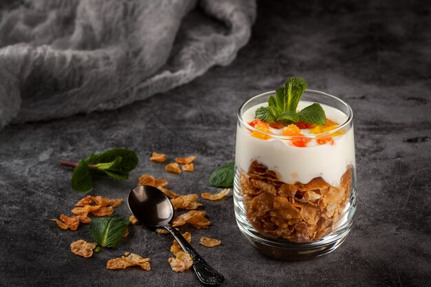 Cottage cheese dessert with cornflakes in a glass