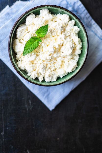 Cottage cheese goat or sheep milk on the table healthy food\
meal copy space food rustic