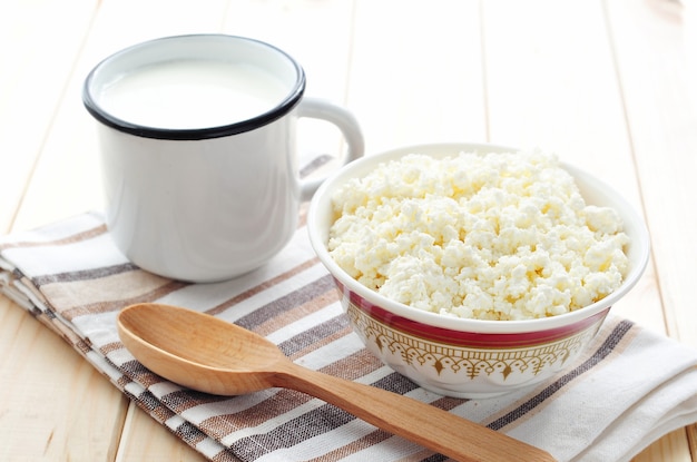 Cottage cheese and mug with milk