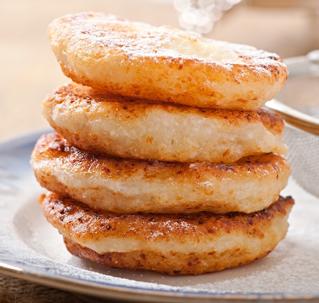 Cottage cheese pancakes sprinkled with powdered sugar