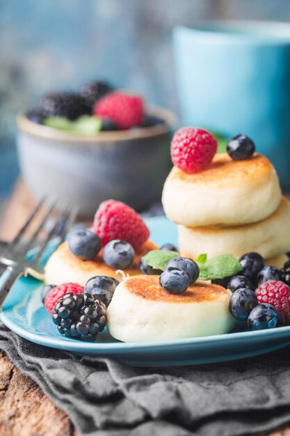 Cottage cheese pancakes with berries. Healthy Breakfast.