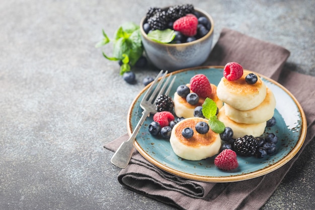 Cottage cheese pancakes with berries. Healthy Breakfast.