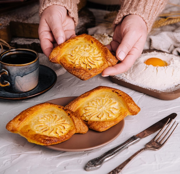 Cottage cheese pastry pies in grandmas arms