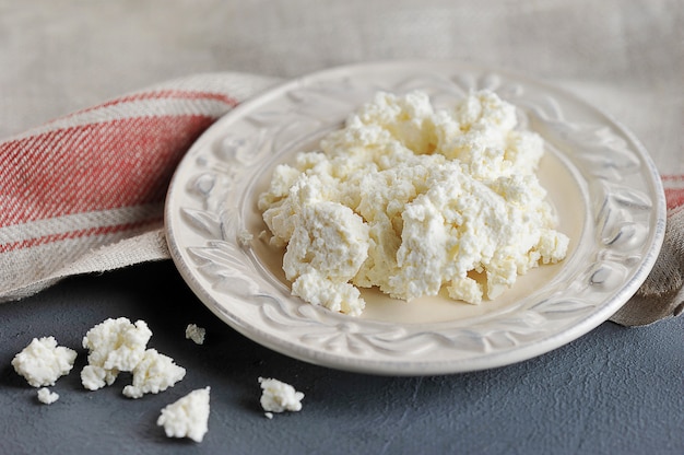 Cottage cheese in a plate on a table