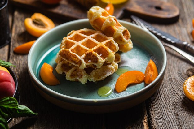 Cottage cheese wafers with apricots and honey in a bowl