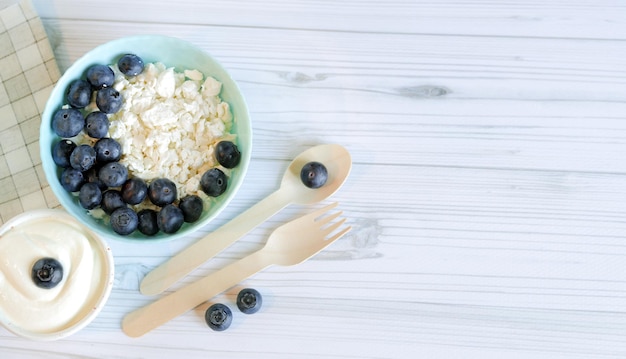 Cottage cheese with blueberries top view copy space Healthy keto breakfast concept