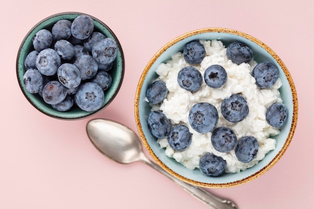 Cottage cheese with blueberry fresh berries keto healthy breakfast concept top view