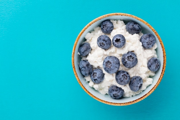 Cottage cheese with blueberry fresh berries keto healthy breakfast concept top view