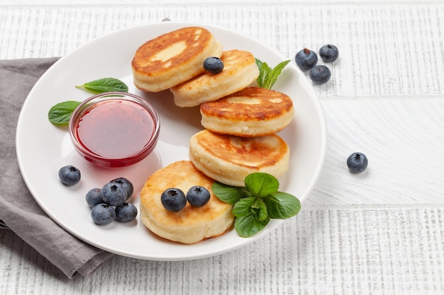 Cottage pancakes with jam and berries