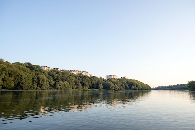 Cottages on the high hill on the river in the trees