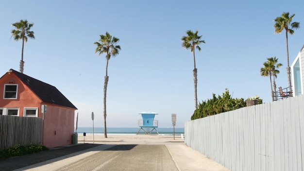 Cottages in oceanside california usa beachfront bungalows ocean beach palm trees lifeguard tower