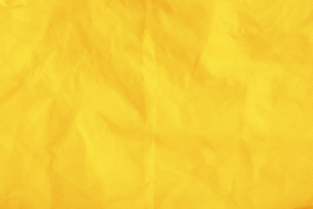 写真 黄色の背景に綿の袋