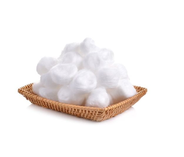 Cotton ball in bamboo basket on a white background.cotton ball for skin care and medical line.