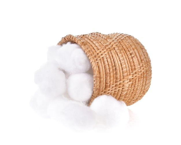 A cotton ball in a basket on a white background