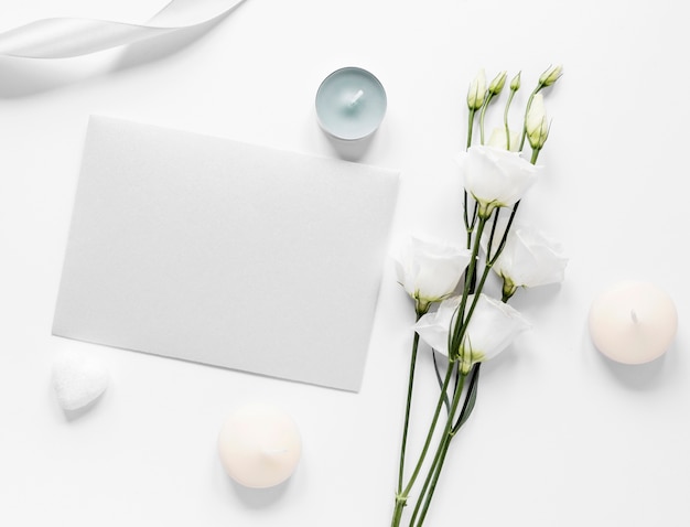 Cotton branches beside wedding card