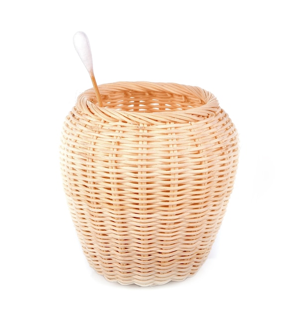 Cotton bud in the basket on white background