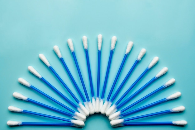 Photo cotton buds on a blue background.