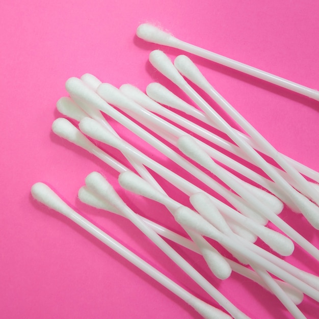 cotton buds on ping background. 