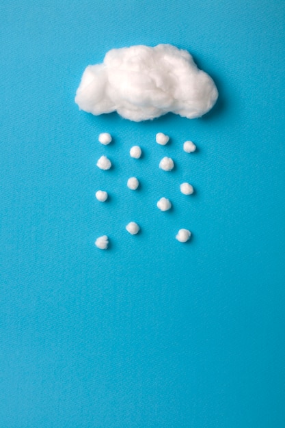 cotton cloud and snowflakes on sky blue  