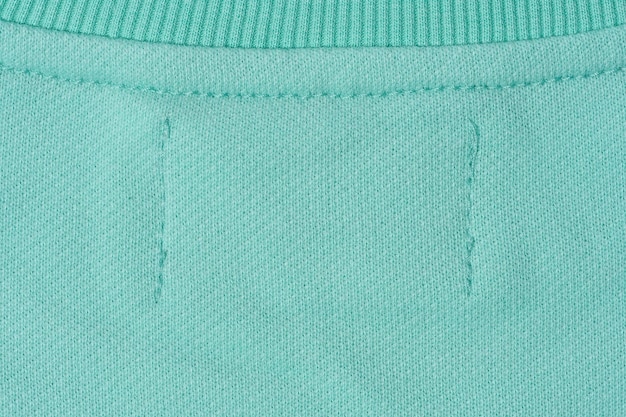 Cotton mintcolored fabric texture for making clothes close up