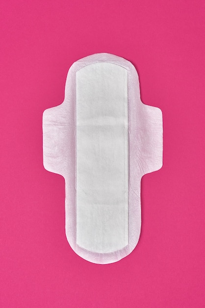 Photo cotton sanitary pad napkin on pink fuchsia background