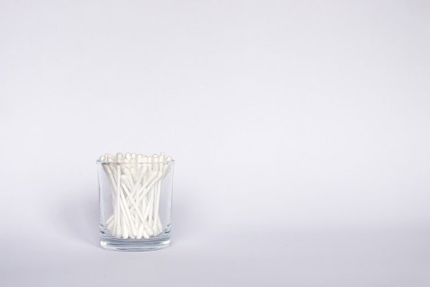 Photo cotton swabs or ear sticks in glass storage.