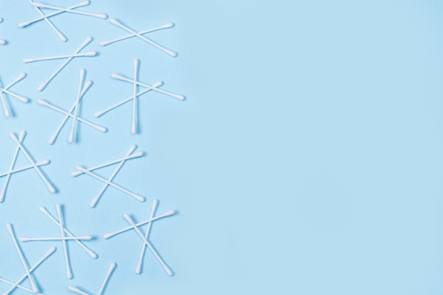 Cotton swabs on a light blue background