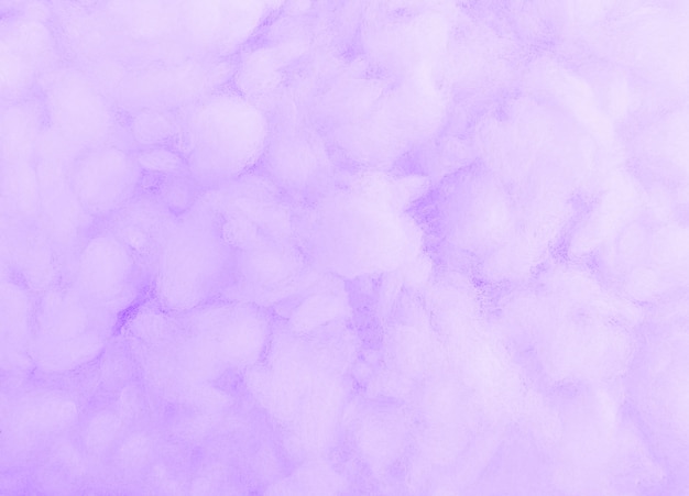 Cotton wool texture. Violet background.