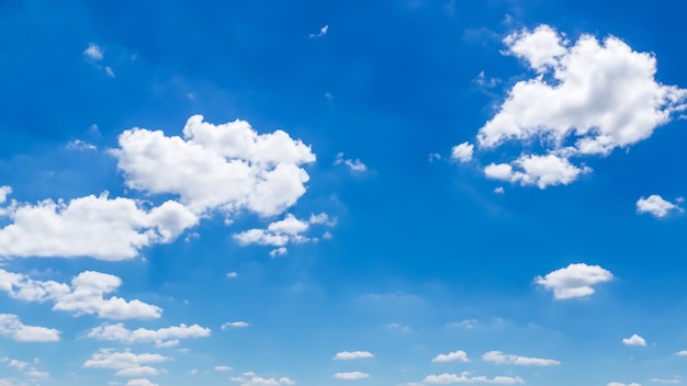 Cottony clouds in a clear blue sky