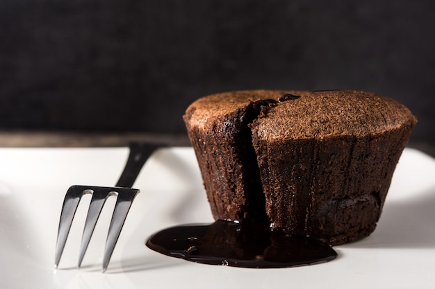 Coulant chocolate cake on wooden table