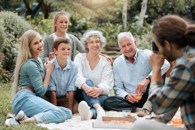 On the count of three. Shot of a multi-generational family spending time together outdoors.