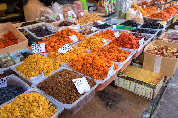 Counter with dried fruits and nuts in the market in Russia