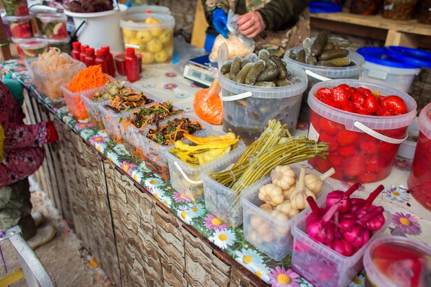 Counter with fermented vegetables in the market in Russia